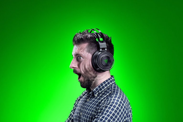 Razer Nari Ultimate Xbox Ed on Male Model with Haptics - Green Background Backlit
