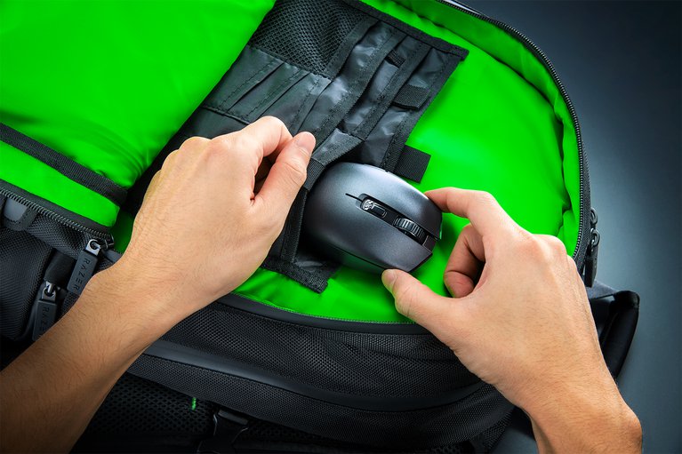 Razer Orochi V2 (Black) in Razer Backpack Male Model Hand