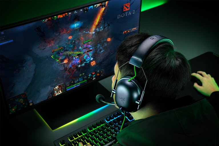 Male Model with Razer Blackshark V2 X (Black) with Workstation DOTA2 (Green Theme)