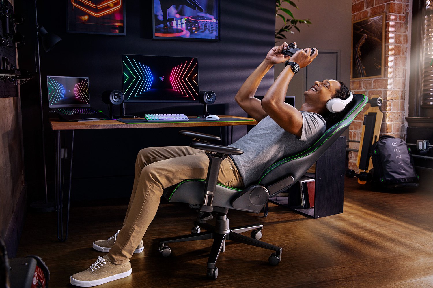 Razer Enki (Green) Tilt-Back with Male Model in Razer Workroom (Side View)