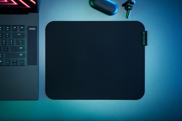 Razer Sphex V3 Small with Razer Blade Pro and Razer Hammerhead True Wireless - Silver Blue Surface with Light (Top-Down View)