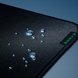 Razer Strider Razer Tag Closeup with Water Droplets Liquid Resistant - Silver Surface with Light
