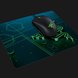 Razer Goliathus Mobile Mat with Razer Abyssus V2 Mouse - Black Background with Light (Angled View)